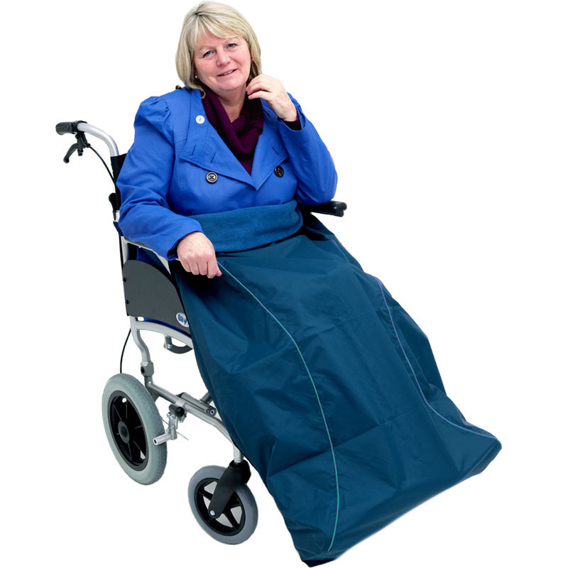 Woman in a wheelchair wears a waterproof cover