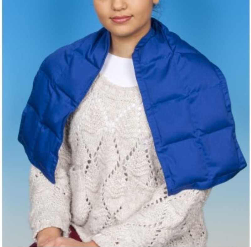 Teenage girl wears a bright blue weighted short cape on her shoulders
