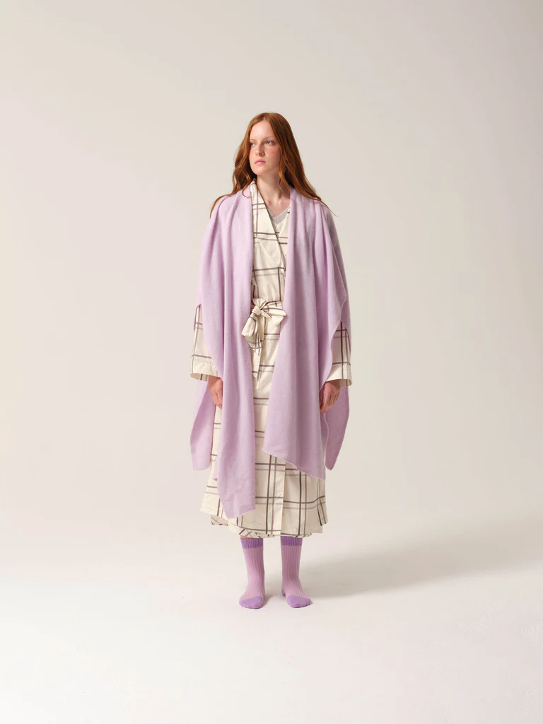 Woman wears luxurious lilac cashmere long shawl