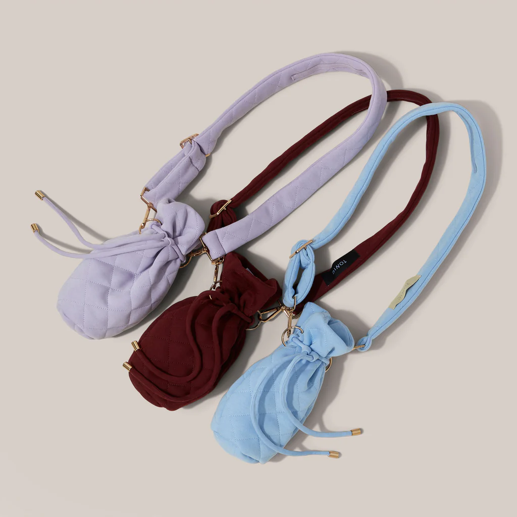 A trio of drain bags in lilac, burgundy and pale blue