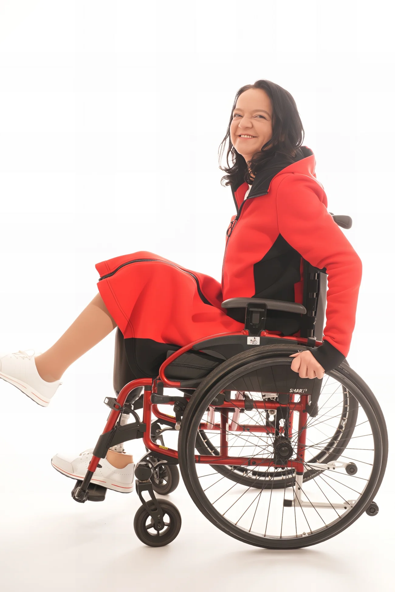 Woman wears Adaptive Jersey jacket in red