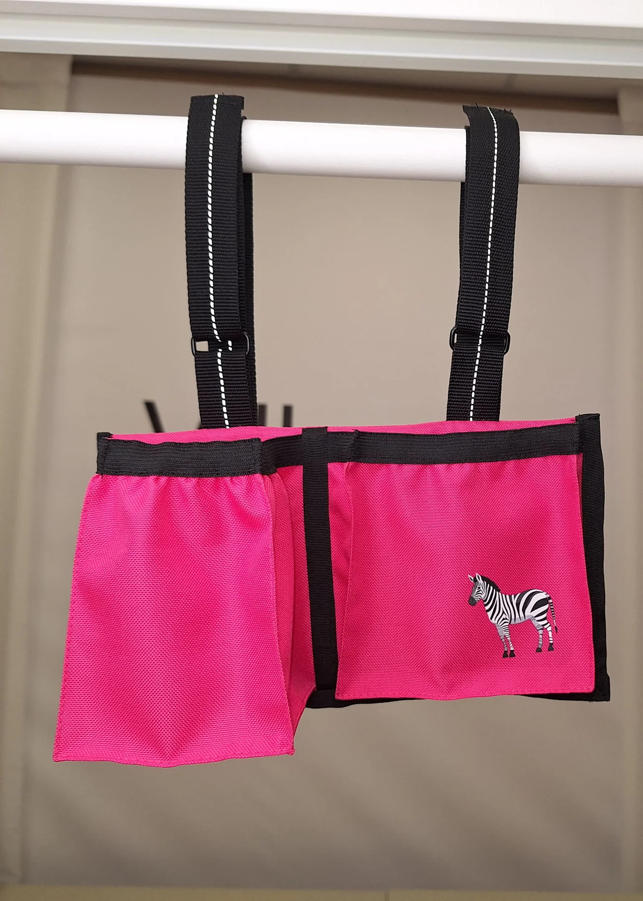 Bright pink wheelchair bag with zebra motif