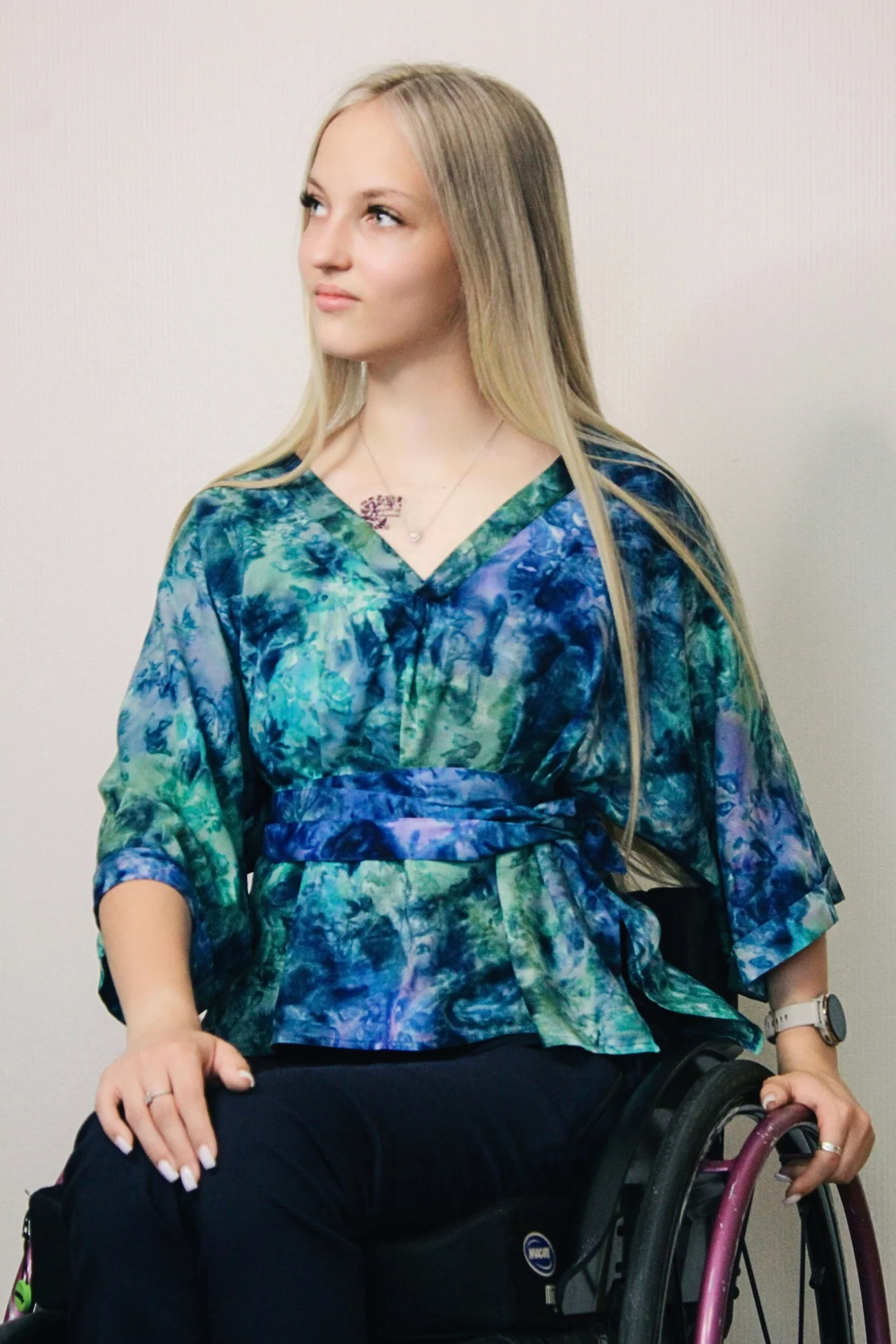 Woman wear Adaptive Kimono Sleeve Blouse in green and blue Batik