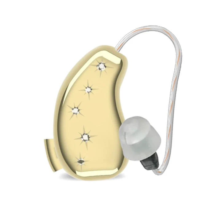 Gold hearing aid cover with diamnte stars
