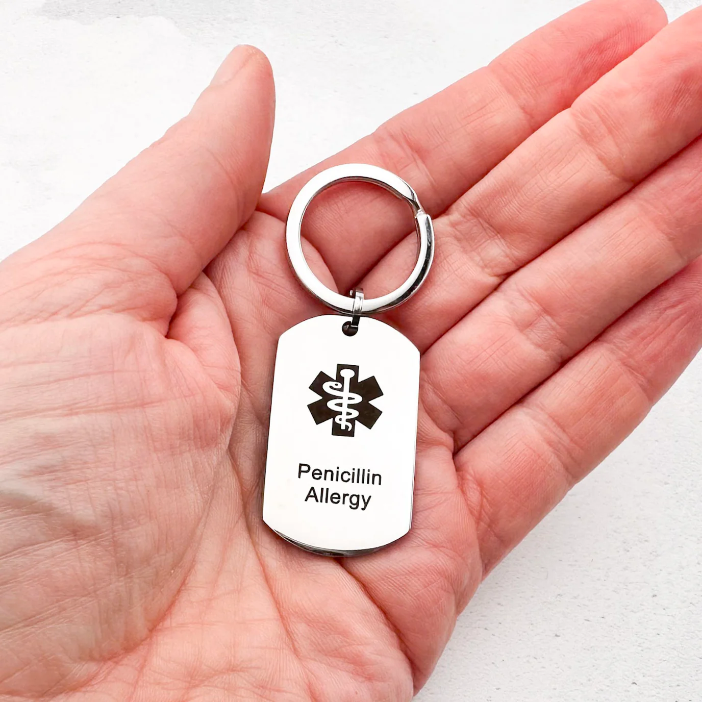 Silver keyring with medical alert for Penicillin allergy written in black