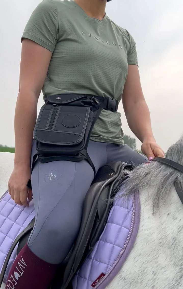 Woman wears special designed bag for horse riders