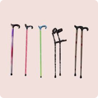 Montage showing a purple, pink and silver gradient stick, a pink and green stick and a black pair of crutches