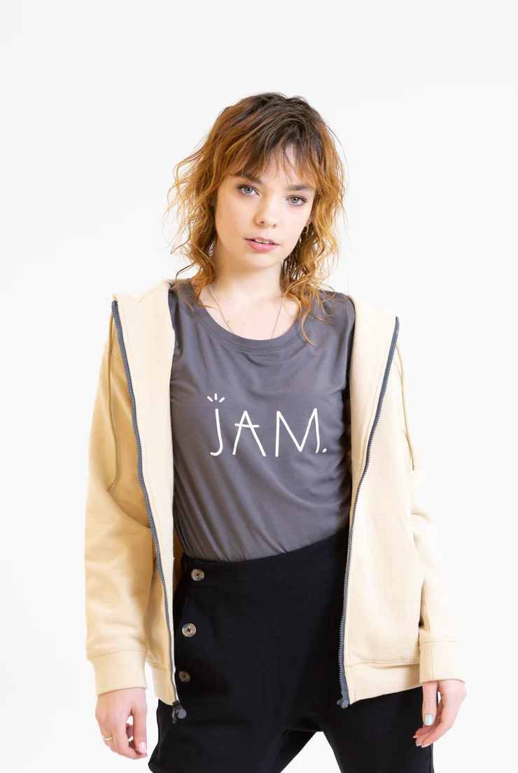 Grey t shirt with JAM logo in white worn by woman wearing a hoodie