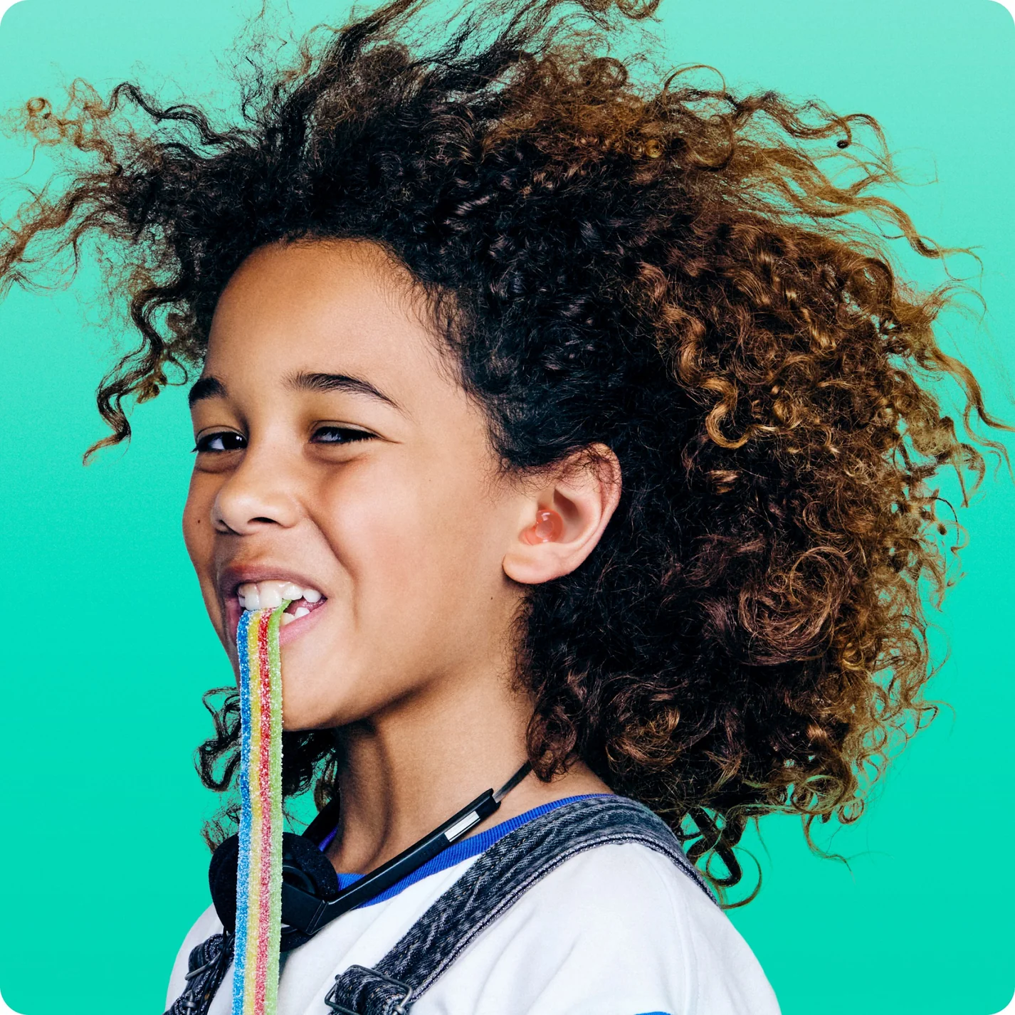 Child shown wearing kids earplugs
