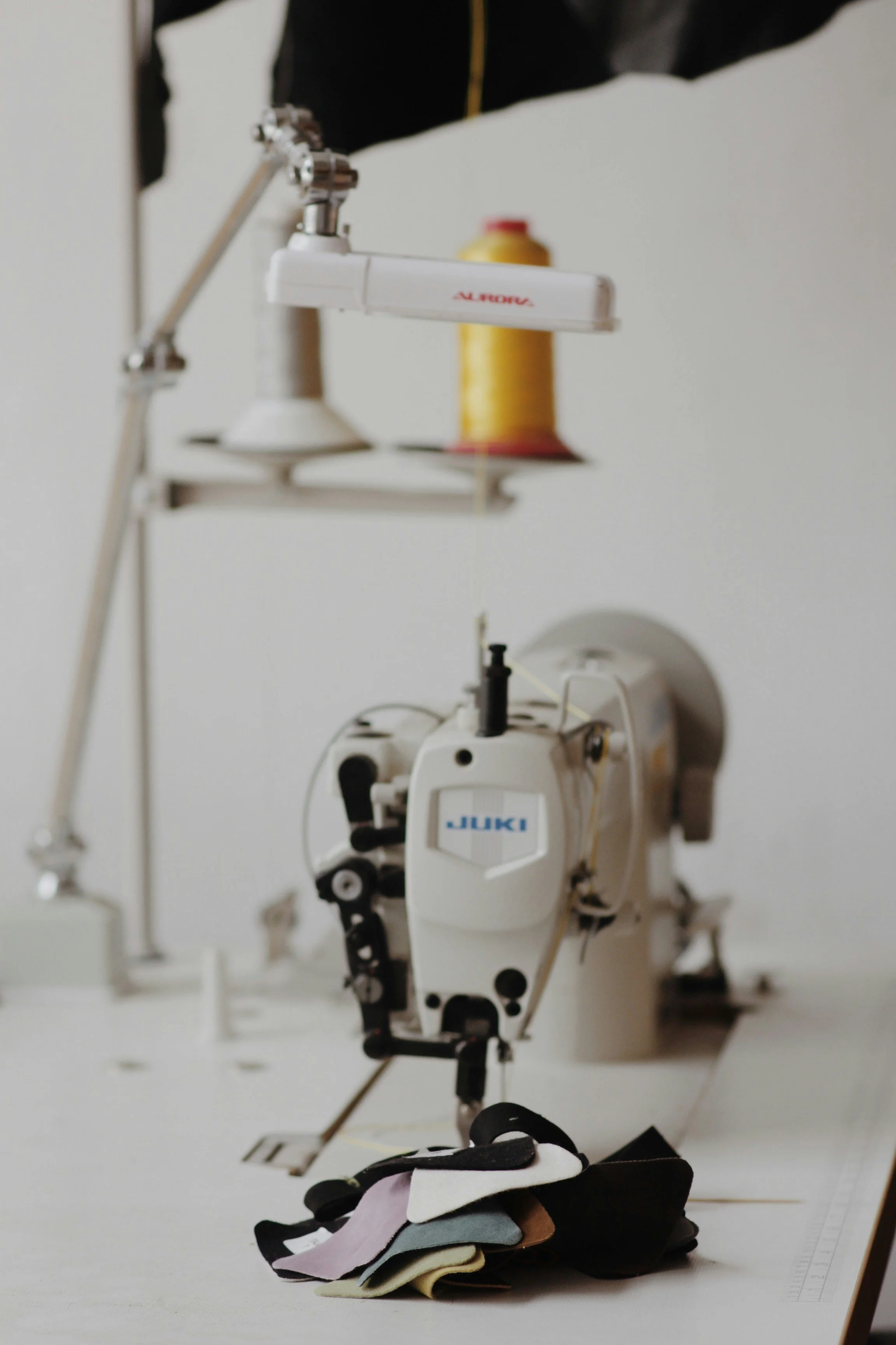 A sewing machine is set up with a yellow cotton