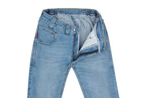 Light blue washed denim jeans shown unbuttoned showing the zip fastening