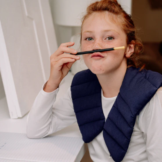 Child wears weighted collar