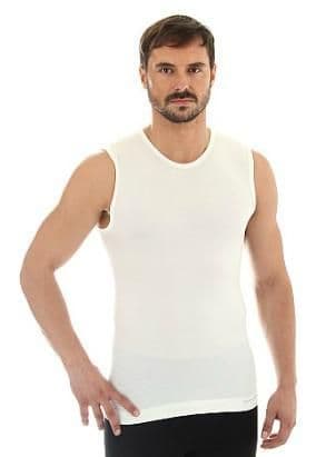 Man wears seam free white vest made from merino wool