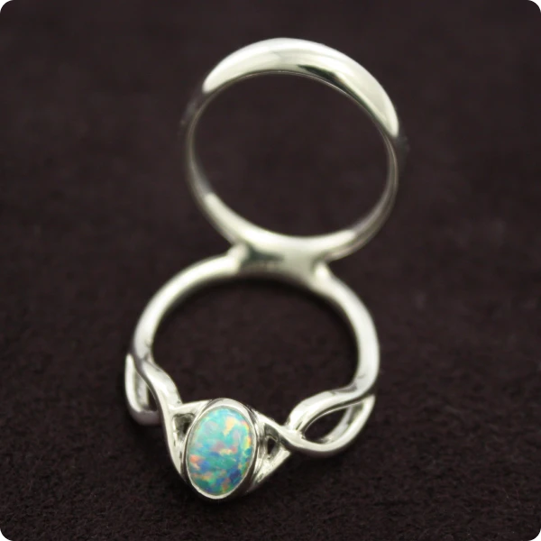 splint with man made gilson white opal that looks blue and sparkly