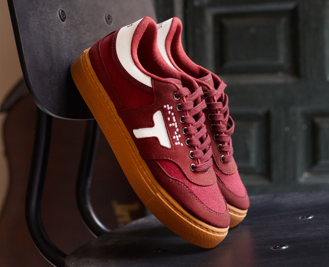 Red trainers with a T for Timpers and braille