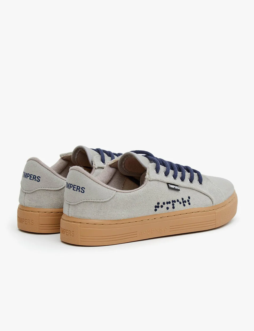 Pale grey trainers with braille