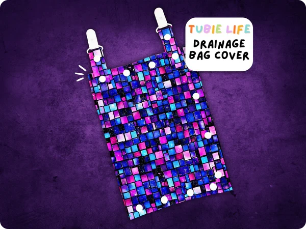 Catheter drainage bag cover with purple, pink and blue squares pattern