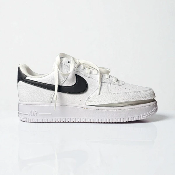 White trainer with Nike tick showing inserted zip